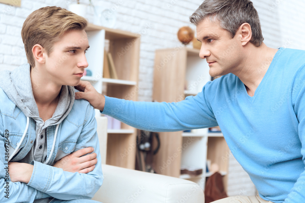 Father apologizes to offended son at home. Father apologizes to offended son at home.