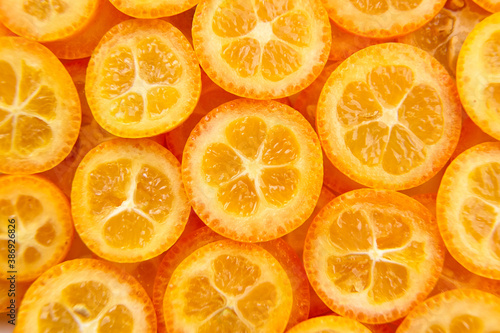 kumquat citrus fruit slices background