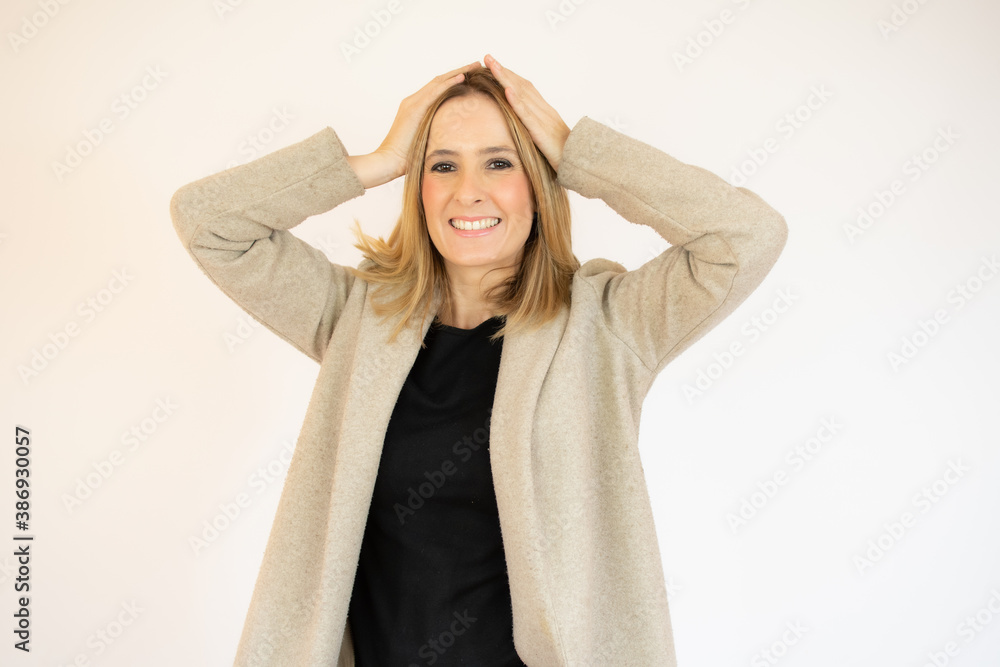 Image of shocked excited young lady standing isolated over white background. Looking camera. Image of shocked excited young lady standing isolated over white background. Looking camera.