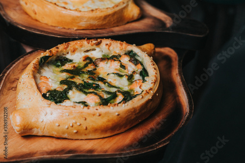 Adjari khachapuri with smoked salmon photo