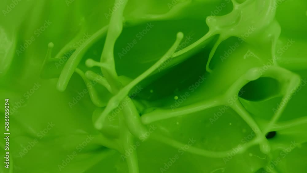 Super slow motion of splashing green paint. Abstract background. Filmed on high speed cinema camera, 1000 fps. Super slow motion of splashing green paint. Abstract background. Filmed on high speed cinema camera, 1000 fps.