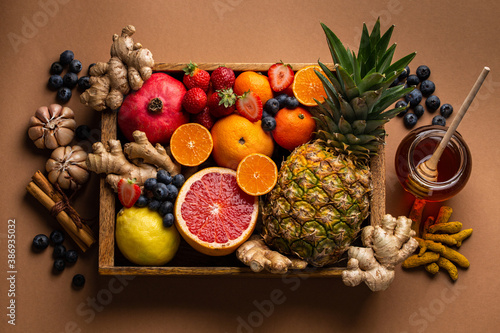 Fototapeta Naklejka Na Ścianę i Meble -  Healthy nutrition during flu and cold season. Selection of fresh fruit with vitamin C and natural ingredients to boost immune system. Organic food for immunity stimulation and against viruses.