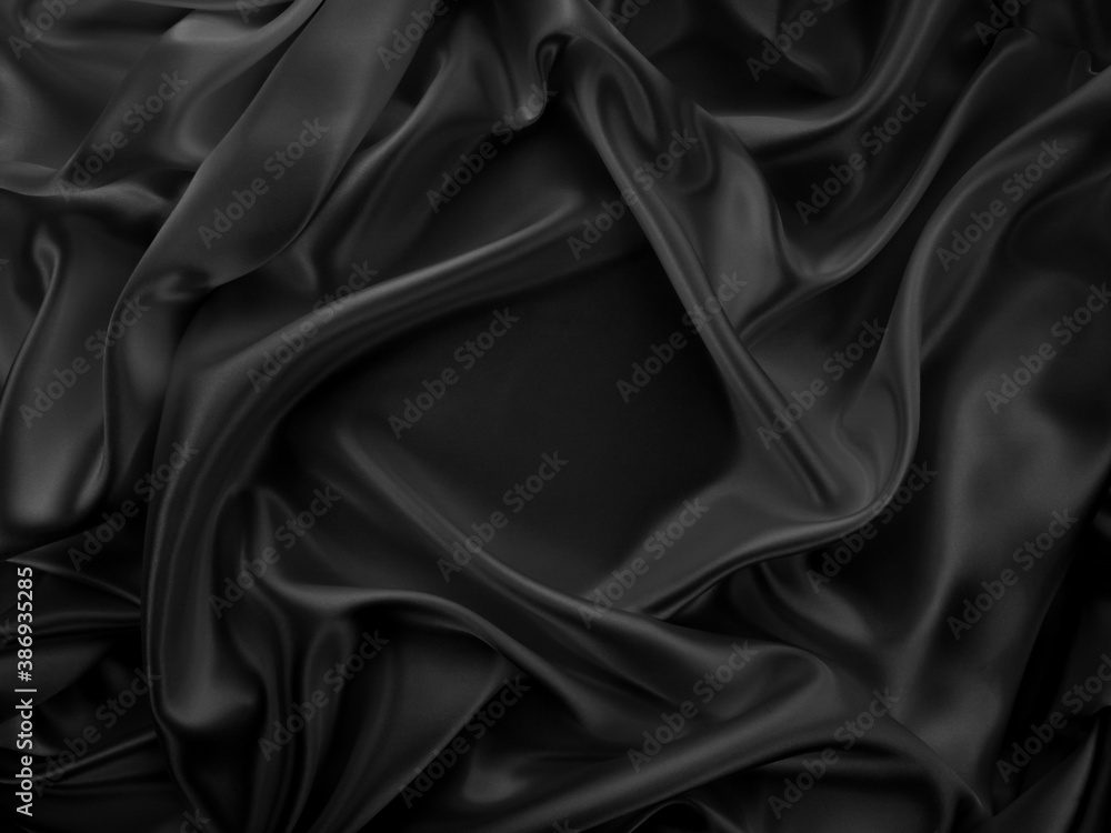 Beautiful elegant dark silver grey or black satin silk luxury cloth fabric texture, abstract background design. Beautiful elegant dark silver grey or black satin silk luxury cloth fabric texture, abstract background design.