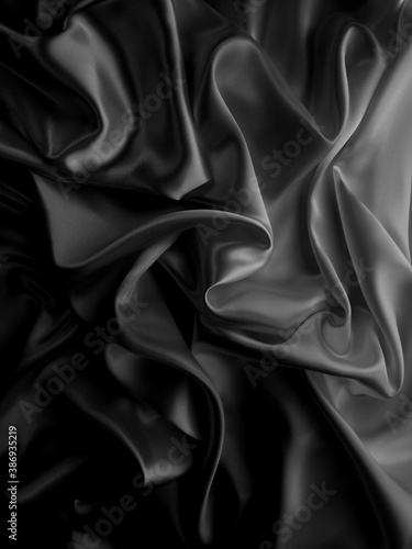 Beautiful elegant dark silver grey or black satin silk luxury cloth fabric texture, abstract background design.