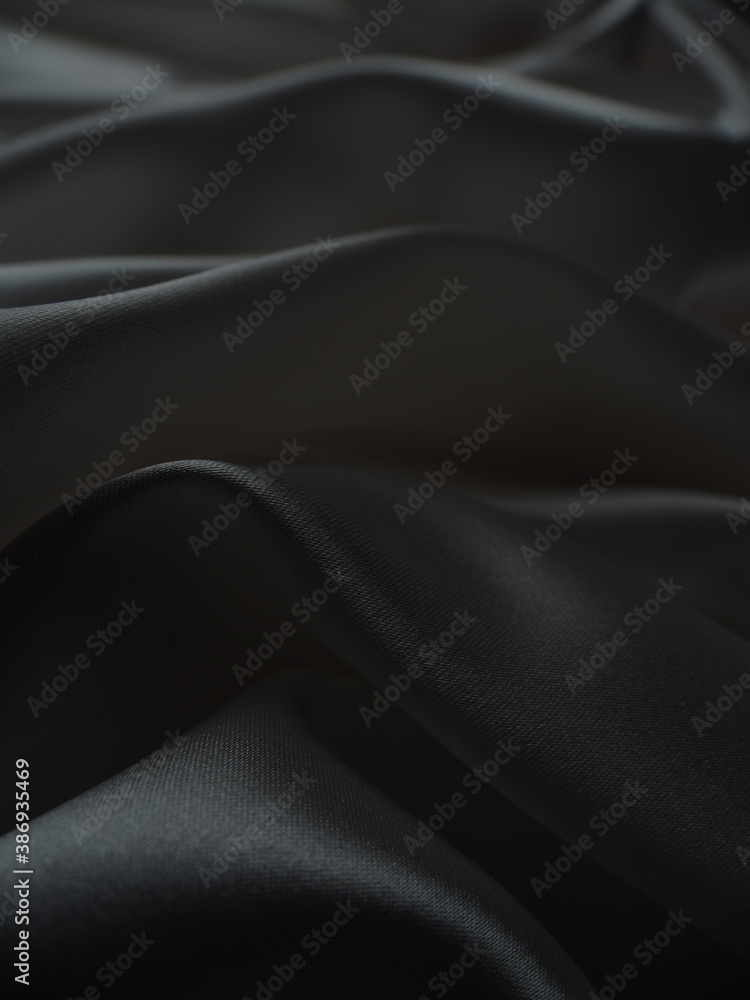 Fototapeta premium Beautiful elegant dark silver grey or black satin silk luxury cloth fabric texture, abstract background design.