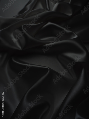 Beautiful elegant dark silver grey or black satin silk luxury cloth fabric texture, abstract background design.