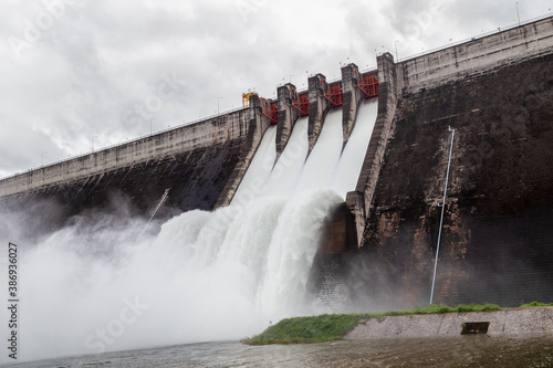 Photos Water flowing over floodgates of a dam at Khun Dan Prakan Chon, Nakhon Nayok Pro