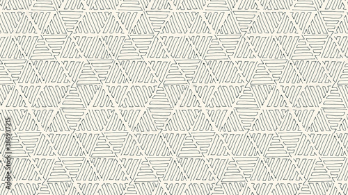 Abstract geometric black-white seamless pattern with hand drawn hatched triangles. Vector doodle background.