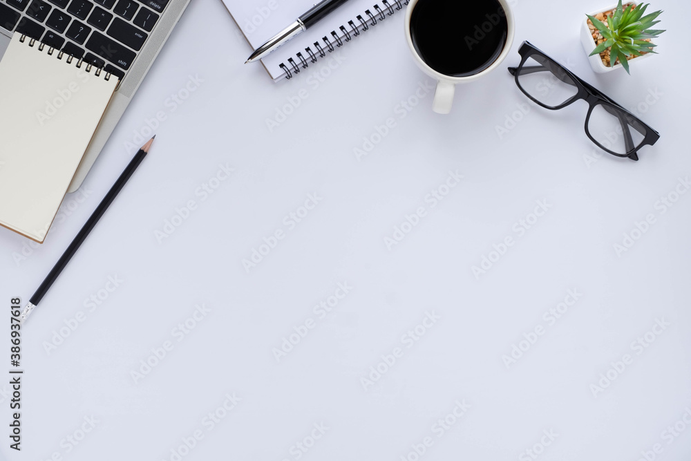 Top view above of White office desk table with keyboard, notebook and coffee cup with equipment other office supplies. Business and finance concept. Workplace, Flat lay with blank copy space. - obrazy, fototapety, plakaty 