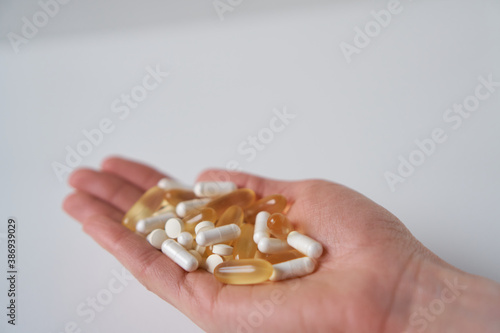 Medicine pills and supplements. Medicine in palm.
