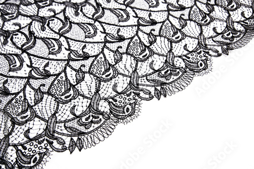 Black openwork lace isolated on white background. photo