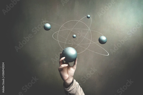 illustration of hand holding sphere that represents planets activities, science surreal concept