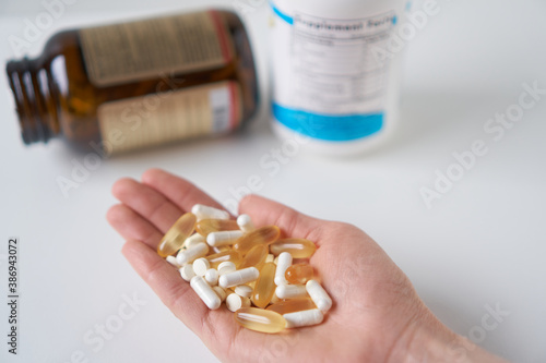 Medicine pills and supplements. Medicine in palm.  