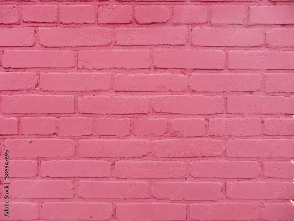 Brick wall texture, pink background with copy space Brick wall texture, pink background with copy space