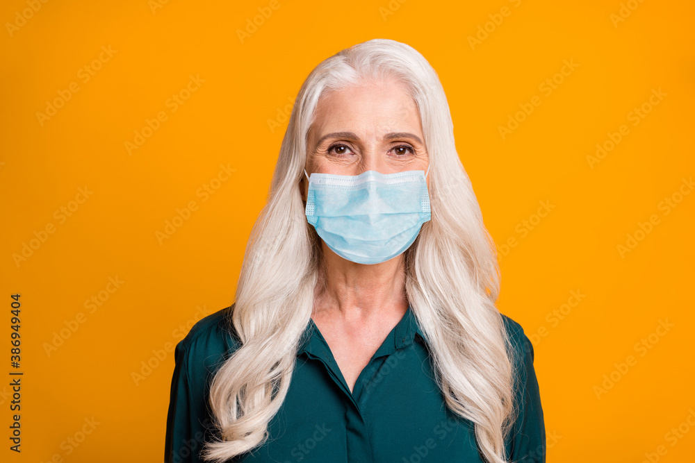 Photo of beautiful grandma cheerful person feel young wear mask green shirt isolated vibrant yellow background Photo of beautiful grandma cheerful person feel young wear mask green shirt isolated vibrant yellow background