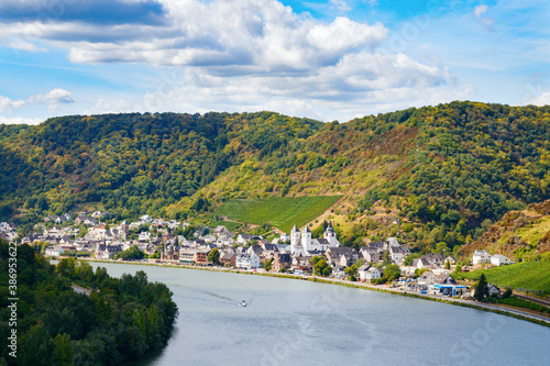 Aerial view of the Treis-Karden municipality athe riverside, the river Moselle and the surrounding hills on a sunny day. Cochem-Zell, Rhineland-Palatinate, Germany. photo