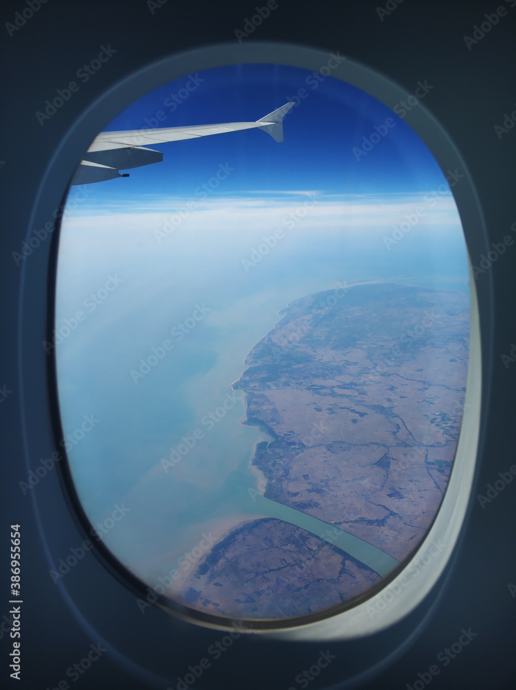 The view from the airplane window to the ground. Landscape view from the sky