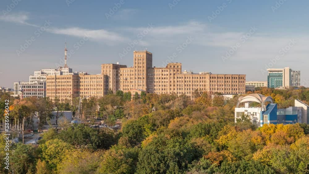 Aerial panoramic view to a National Univercity in the Shevchenko Garden timelapse. Park with yellow, red and green trees at autumn evening. Kharkov, Ukraine Aerial panoramic view to a National Univercity in the Shevchenko Garden timelapse. Park with yellow, red and green trees at autumn evening. Kharkov, Ukraine
