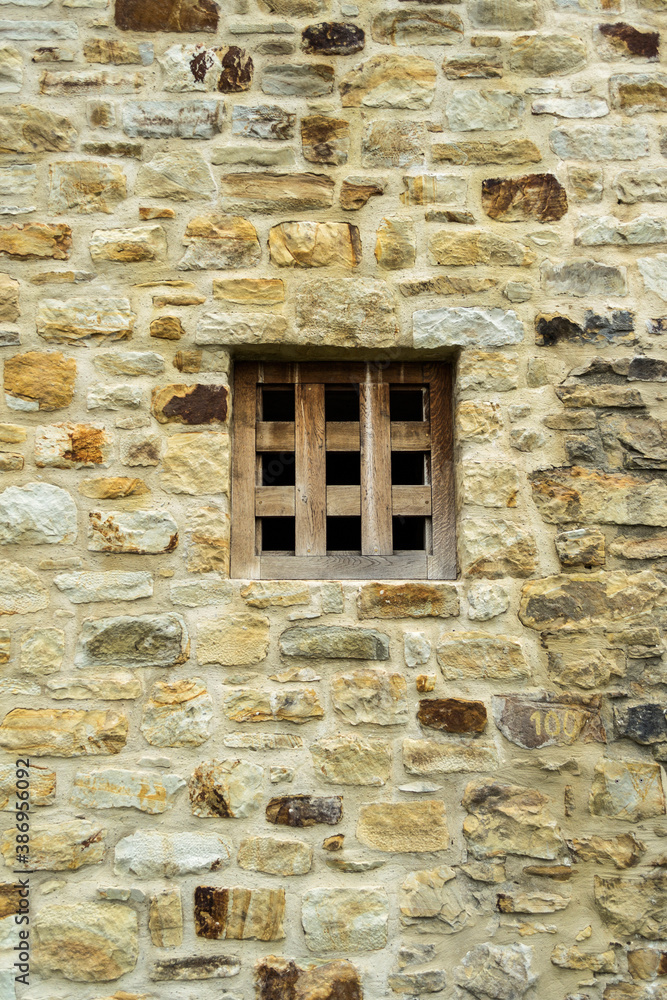 Stone wall with wood window.