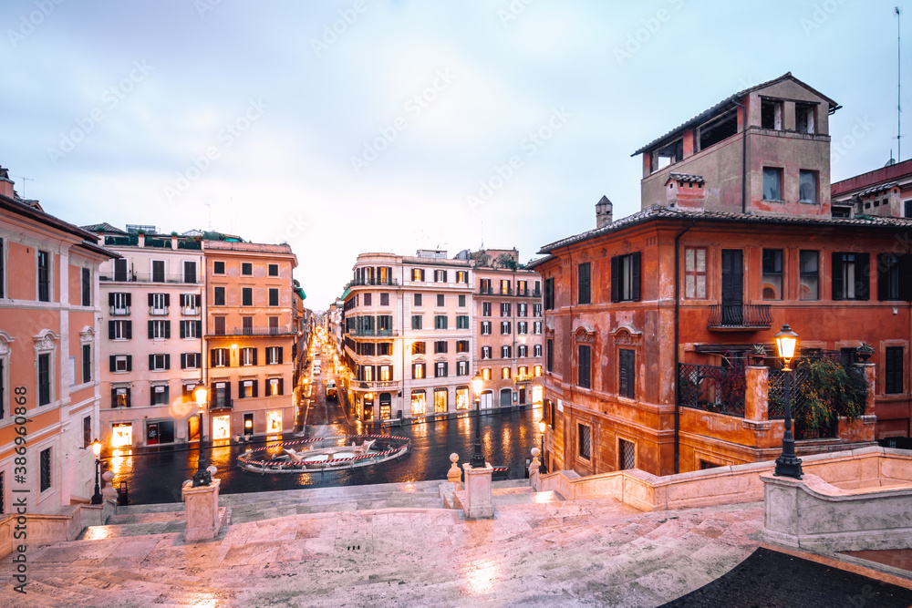Italy Rome the Spanish stairs in the morning people empty and beautiful surroundings with old houses, illuminated