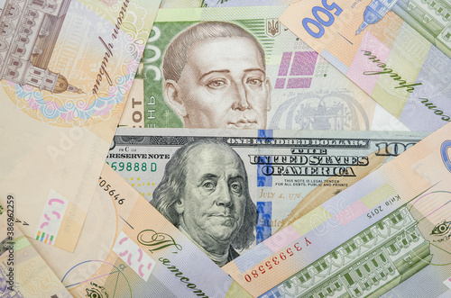 Currency ratio concept. 100 dollar bill and 500 Ukrainian hryvnia. Close-up.