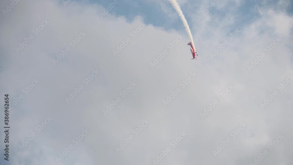Sport airplane performing aerobatics Sport airplane performing aerobatics