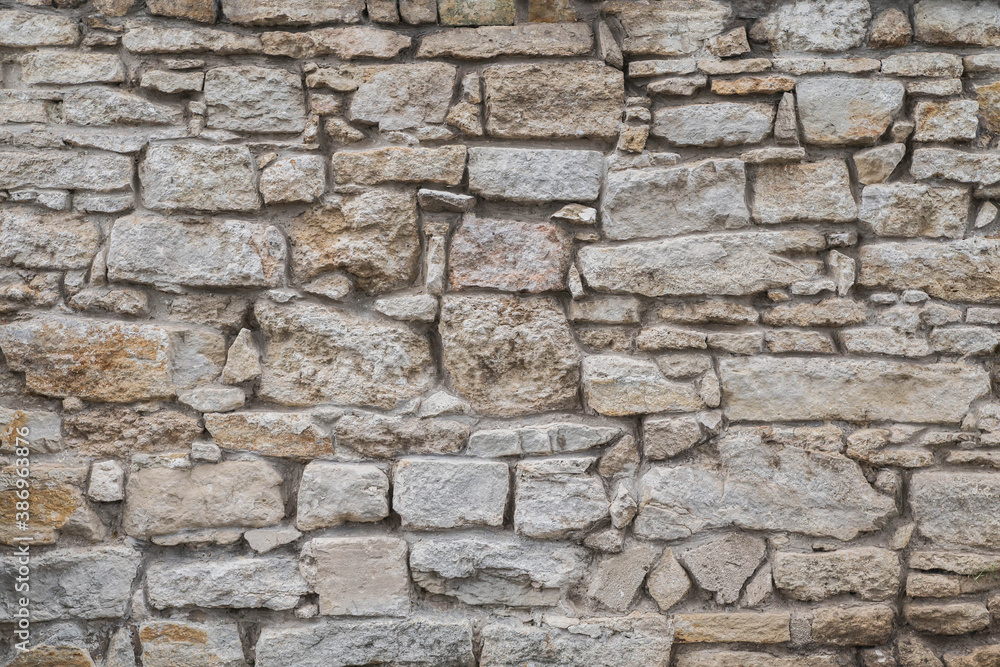 Old crumbling stone wall in an abandoned castle