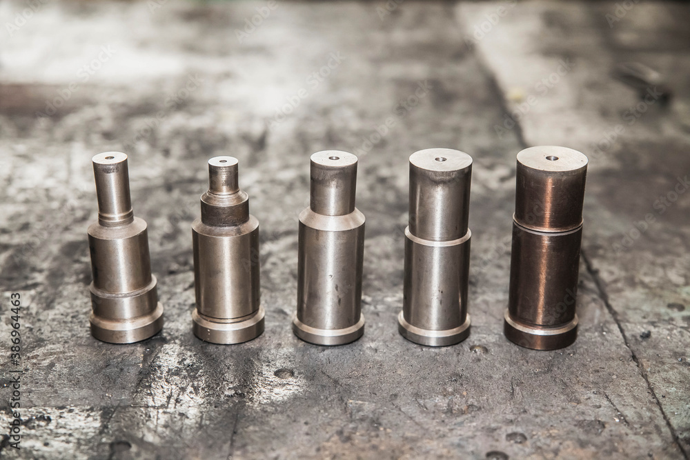 round polished metal workpieces lie at factory in stock round polished metal workpieces lie at factory in stock