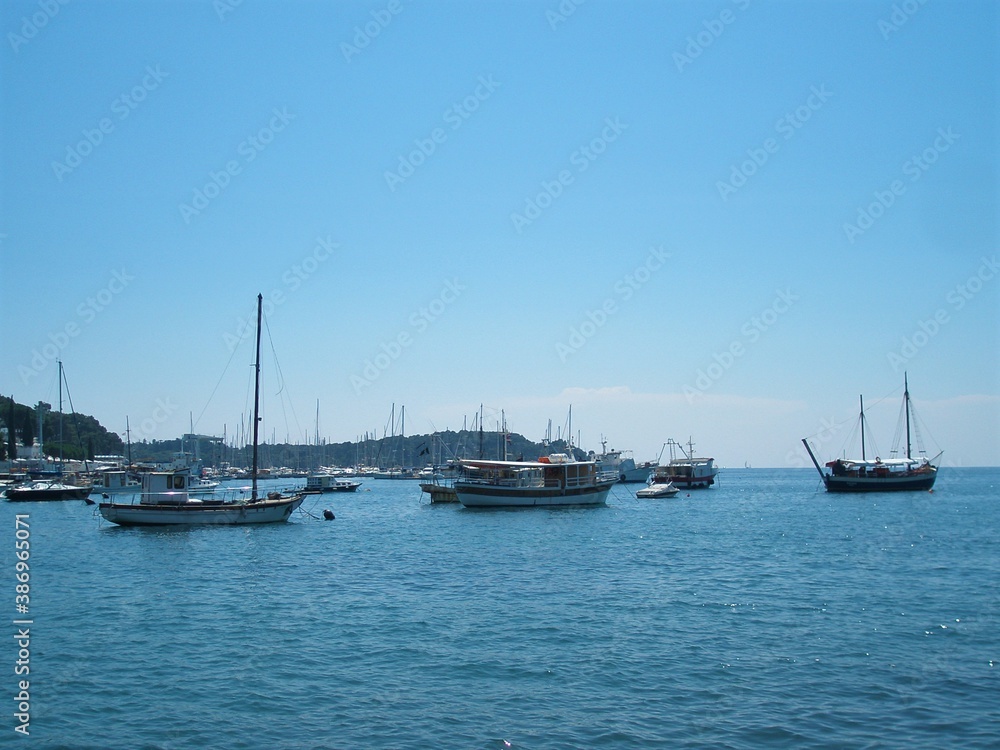 sailboats at the coast or bay of Croatia, with blue sky. Template for design of holiday greetings, decoration packaging, postcard, poster