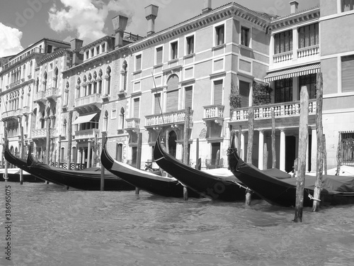 Gondola awaiting service in Venice, Italy. Black & white photography. Template for design of holiday greetings, decoration packaging, postcard, poster