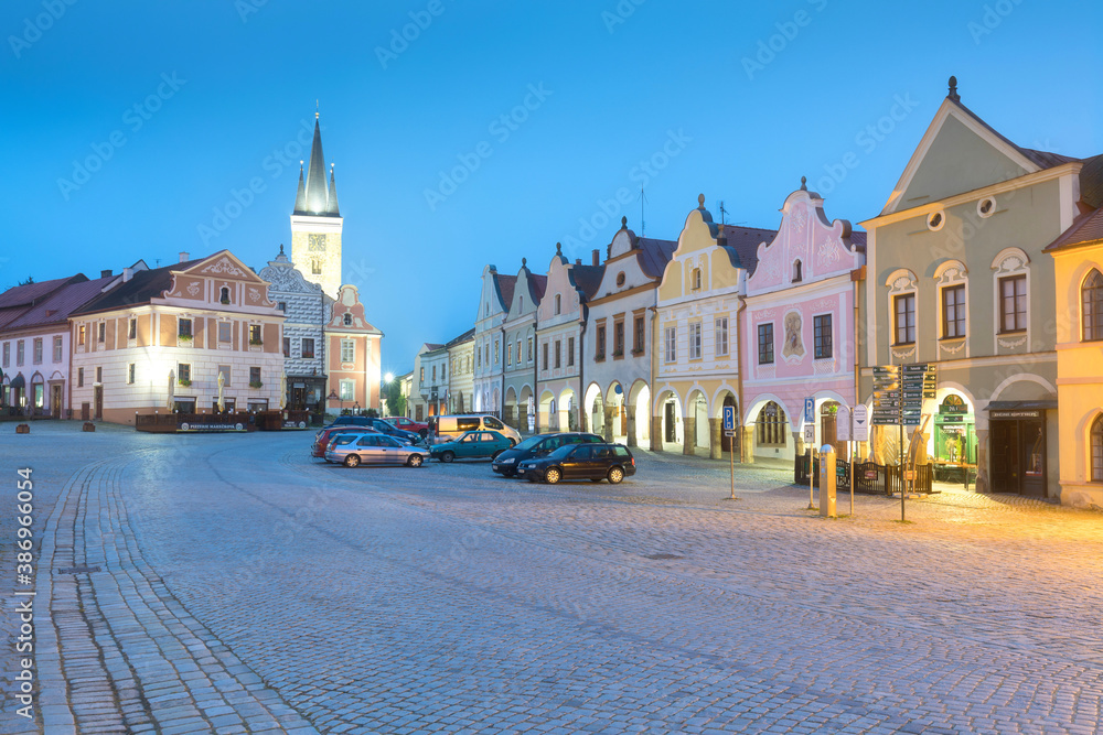 Traditional houses on the main square of Telc, South Moravia, Czech Republic. UNESCO heritage site. Town square in Telc with renaissance and baroque colorful houses. Early evening or night scene.