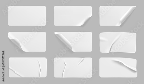 White glued crumpled stickers with curled corners mock up set. Blank white adhesive paper or plastic sticker label with wrinkled and creased effect. Template label tags close up. 3d realistic vector