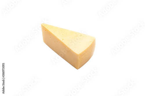 Shooting in the studio. A piece of yellow cheese, cut from the head. Close-up. On white background.
