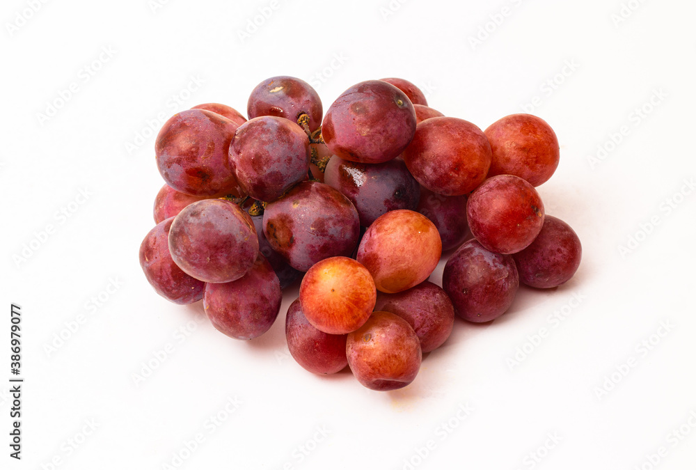 Red delicious bunch of grapes on white background Red delicious bunch of grapes on white background