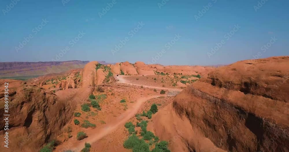Off-roading Vehicle Driving in on Beautiful Desert trail Off-roading Vehicle Driving in on Beautiful Desert trail