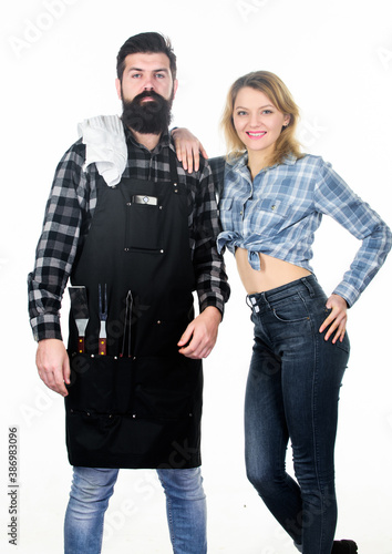 Family weekend. Couple in love hold kitchen utensils. Man bearded hipster and girl. Preparation. Tools for roasting meat outdoor. Picnic barbecue. food cooking recipe. Secret ingredient is love