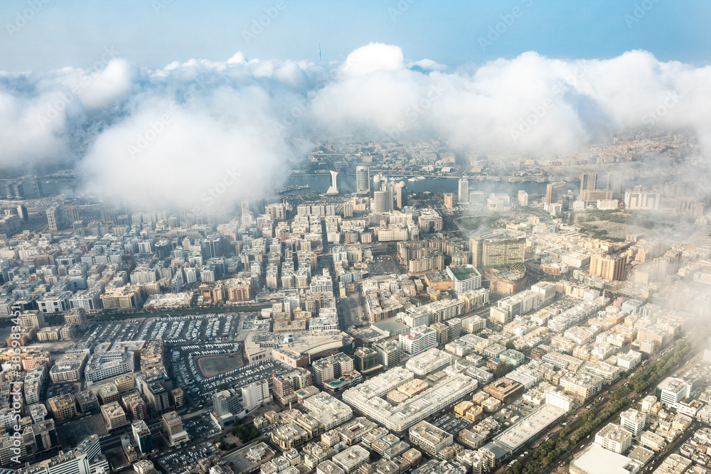 aerial view of great city Dubai with clouds