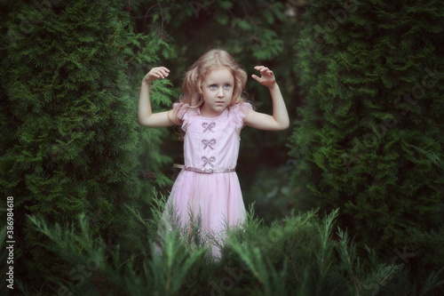 Portrait of a cute girl in a fairy forest.