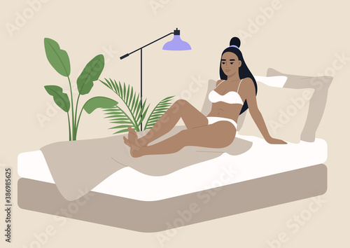 Young Asian lady wearing underwear in her bedroom, morning habits, waking up scene