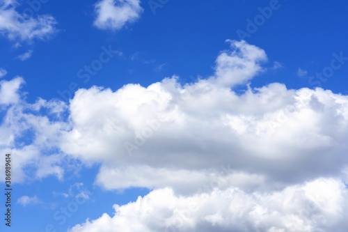beautiful fluffy clouds on a bright blue summer sky
