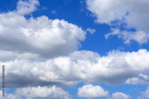beautiful fluffy clouds on a bright blue summer sky © Вячеслав 