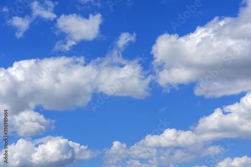 Fototapeta Naklejka Na Ścianę i Meble -  beautiful fluffy clouds on a bright blue summer sky