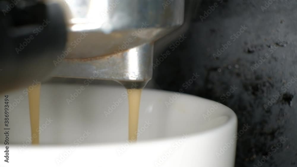 coffee machine making coffee, black coffee pouring into cup, macro shot coffee machine making coffee, black coffee pouring into cup, macro shot