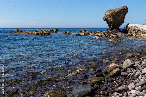 A large balancing rock on a rocky beach in Andalusia's largest coastal protected area, Cabo de Gata-Níjar Natural Park in the southeastern corner of Spain