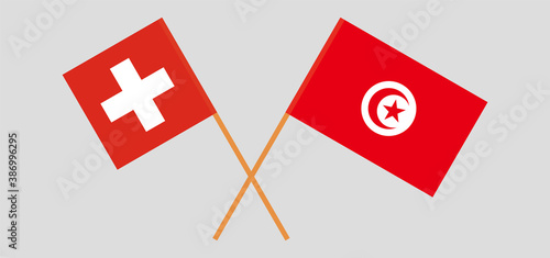 Crossed flags of Tunisia and Switzerland