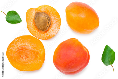 apricot fruits with slices and green leaf isolated on white background. top view. flat lay