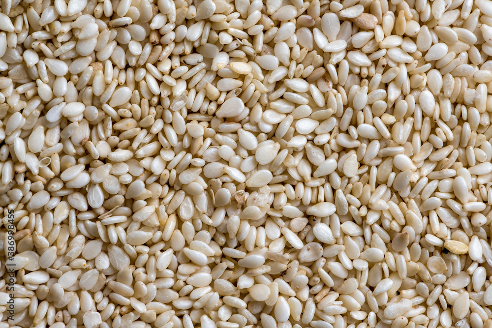 Texture of sesame seeds, top view. Food background. Texture of sesame seeds, top view. Food background.
