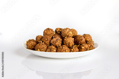 baked cereal balloons with nuts and seeds on a plate healthy food