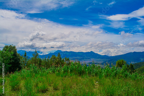 paisaje verde y montañas de fondo cajola  photo