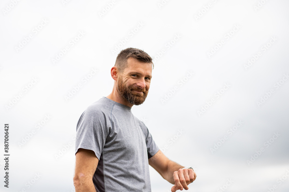runner checking his smart watch runner checking his smart watch